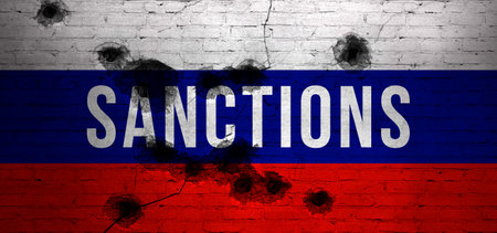 Sanctions text banner background. Bullets shots against Russian flag, cracked and damaged brick wallの写真素材
