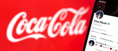 Banner Elon Musk buying Coca-Cola, on background. Selling big company, business and financial concept photoのeditorial素材