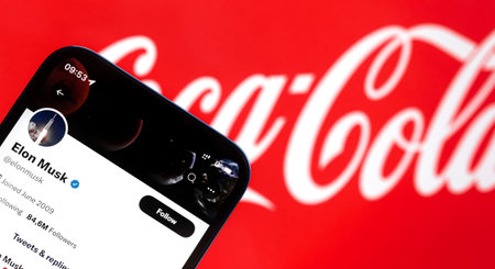 Banner Elon Musk buying Coca-Cola on background. Business and financial concept photoのeditorial素材