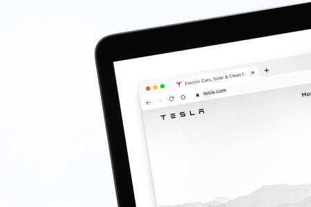 Tesla homepage website with logo background close-up viewのeditorial素材