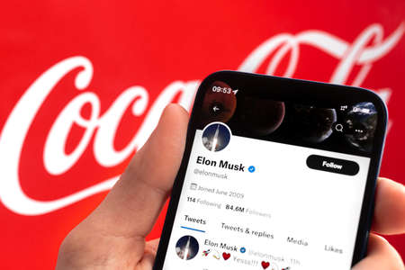 Elon Musk buying Coca-Cola, on background. Business and financial concept photoのeditorial素材
