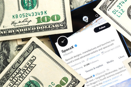 SpaceX company. Dollar money background, business stock concept photoのeditorial素材