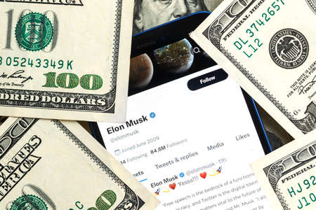 Elon Musk Twitter account and money background. Business and stock concept photoのeditorial素材