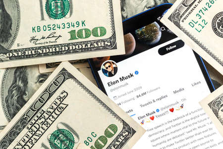 Elon Musk Twitter account and dollar money background. Business and stock concept photoのeditorial素材