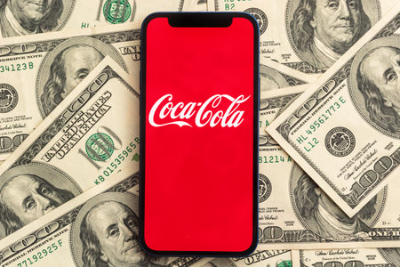 Coca-cola stock market price. close-up view and dollar money background. Business and finance concept photoのeditorial素材