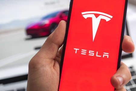 Tesla electric logo background. Elon Musk, Business and transportation of future concept photoのeditorial素材