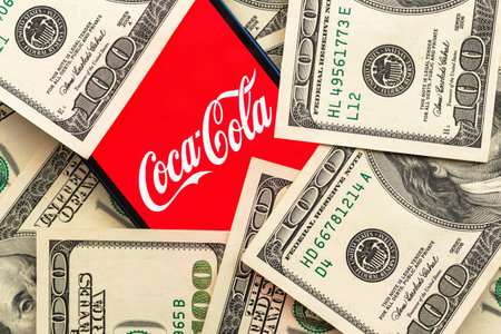 Coca-cola stock market price.  close-up view and dollar money background. Business and finance concept photoのeditorial素材