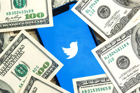 Twitter stock company background with dollar money close-up view photoのeditorial素材