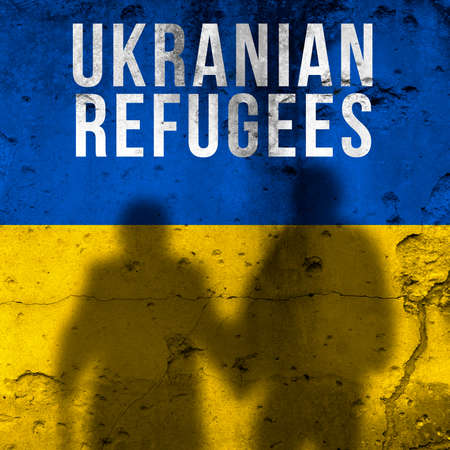 Ukrainian refugees background. War and military conflict concept. Flag painted on concrete wall with people silhouettes photoの写真素材