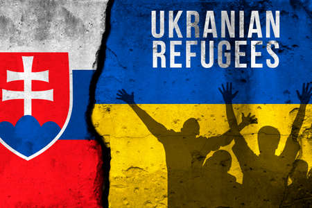 Ukrainian refugees to Slovakia. War and military conflict, Russia aggressor. Crisis, migration and emigration. Flags background with textの写真素材