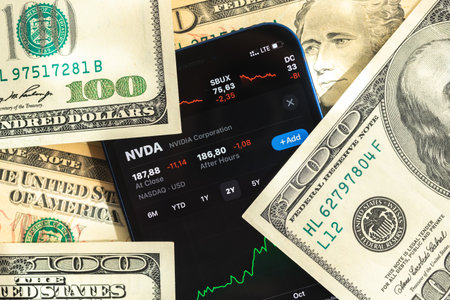 Poltava, Ukraine - April 28, 2022: Nvidia stock trade market background, finance and business concept with dollar money banknotes closeupのeditorial素材
