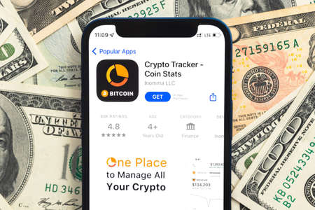 Poltava, Ukraine - April 28, 2022: Crypto Tracker app, crypto currency application for mobile phone. business and investment conceptのeditorial素材