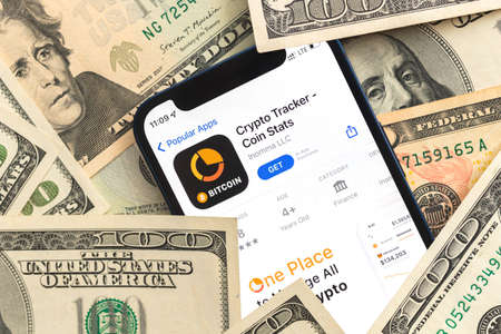 Poltava, Ukraine - April 28, 2022: Crypto Tracker app, crypto currency application for mobile phone. business and investment conceptのeditorial素材