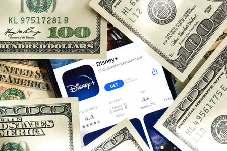 Poltava, Ukraine - April 28, 2022: Disney Plus app, TV streaming application icon close-up on mobile phone, business backgroundのeditorial素材