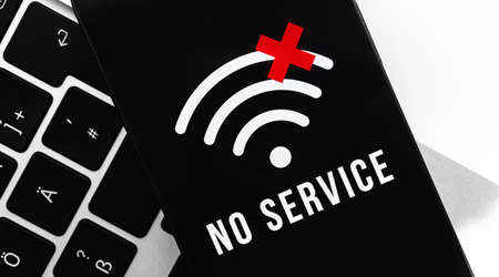 Smartphone with no service screen. Communication, cellular problem, bad internet connection conceptの写真素材