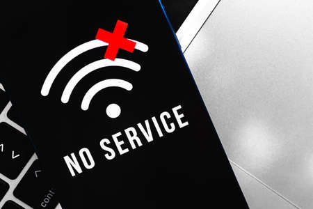 Modern smartphone with no service screen. Communication, cellular problem, bad connection conceptの写真素材