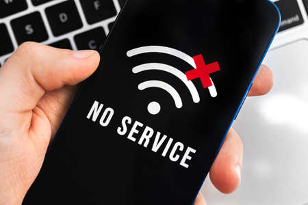 Mobile phone with no service screen. Communication, cellular problem, bad connection conceptの写真素材
