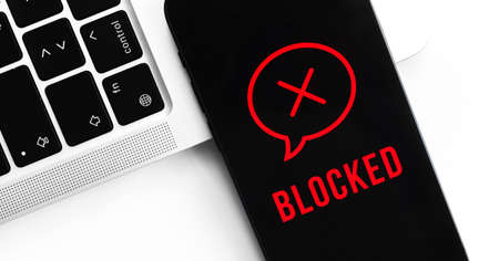 Blocked messages concept, mobile phone privacy background. Black screen with icon and text. modern technologies photoの写真素材