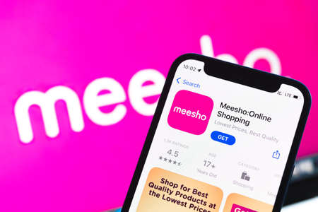 Poltava, Ukraine - May 2, 2022: Meesho Online shopping app icon close-up view, mobile phone with Meesho application, backgroundのeditorial素材