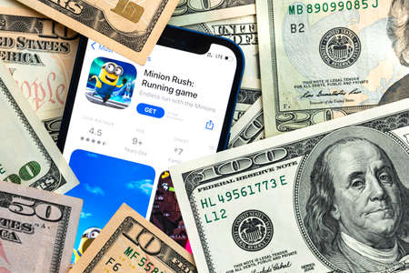 Minion Rush mobile game app. Money background. Concept, company making money with popular mobile phone gamesのeditorial素材