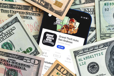 GTA San Andreas mobile game app. Money background. Concept, company making money with popular mobile phone gamesのeditorial素材