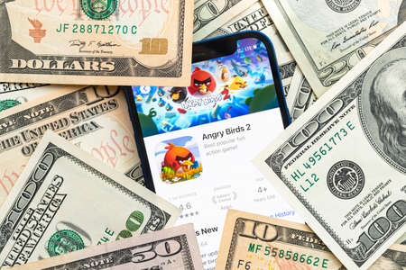 Angry Birds 2 mobile game app. Money background. Concept, company making money with popular mobile phone gamesのeditorial素材