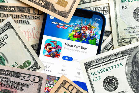 Mario Kart Tour mobile game app. Money background. Concept, company making money with popular mobile phone gamesのeditorial素材