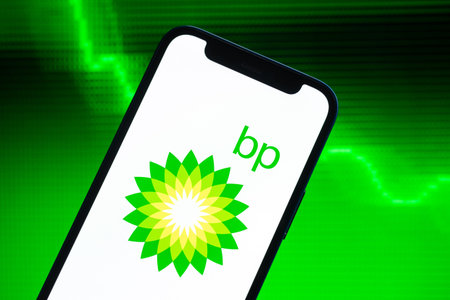 Poltava, Ukraine - May 9, 2022: Index of Brent crude oil prices, logo close-up. Green stock market...