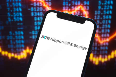 JXTG Nippon logo company, gas and oil prices, energy industry. Petroleum stock market graphs, global financial background. Gasoline and diesel conceptのeditorial素材