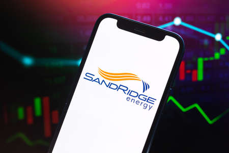 SandRidge Energy logo company, gas and oil prices, energy industry. Petroleum stock market graphs, global financial background. Gasoline and diesel conceptのeditorial素材