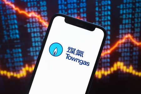 Towngas logo company, gas and oil prices, energy industry. Petroleum stock market graphs, global financial background. Gasoline and diesel conceptのeditorial素材