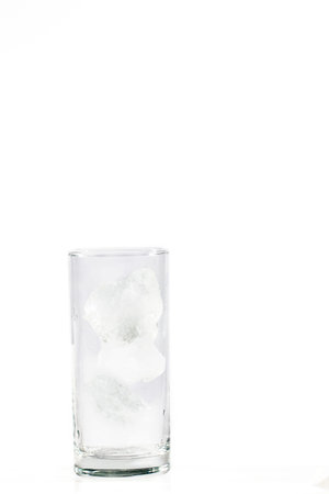 glass with ice cubes on white backgroundの写真素材
