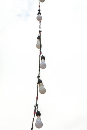 outdoor string lights hanging on a line in backyard