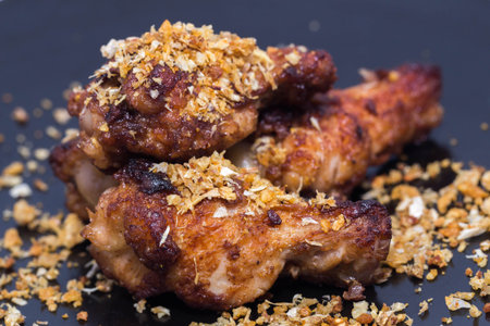 Close up Garlic Chicken Fried  leg on a back backgroundの写真素材
