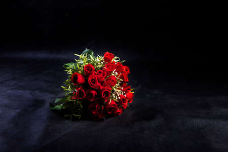 Bouquet of roses on the black scene.Blank space for text and images.の写真素材