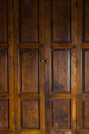 Dark brown Thai style wooden door.Thai style wooden door surface