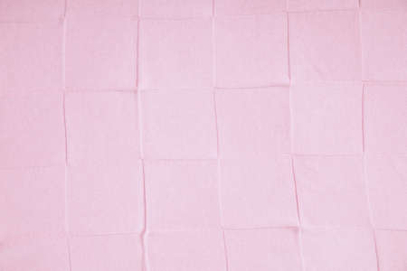 pink cloth texture Square grid shape.Gives a feeling of sweetness and facial expression.This is a newborn diaper.の写真素材