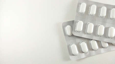 2 packs of calcium tablets on white, placed on a white background. V2の写真素材