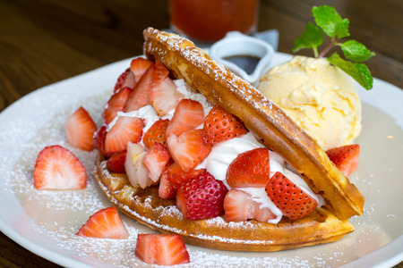Strawberry waffle with vanilla icecream.の写真素材