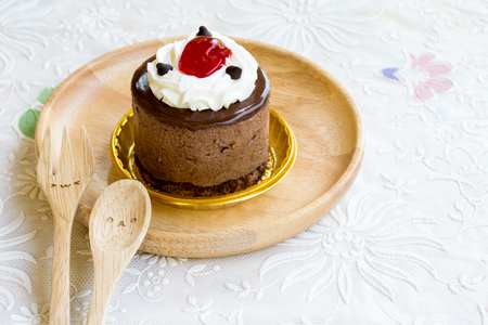 Chocolate mousse cake with cute spoon and forkの写真素材
