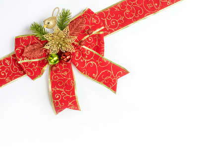 Red and gold ribbon with bow with tails on white backgroundの写真素材