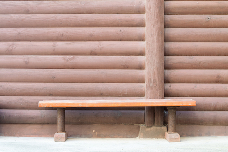 A chair on a wooden planks brackgroundの写真素材