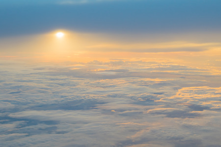 Divine sunset above the cloudsの写真素材