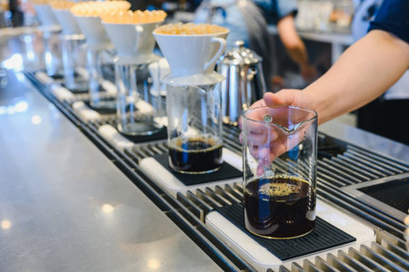 Barista making drip coffee in coffee shop