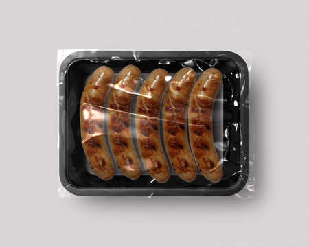 Food packaging isolated with grill sausage top viewの写真素材