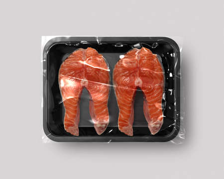 Food packaging isolated with salmon steak top viewの写真素材