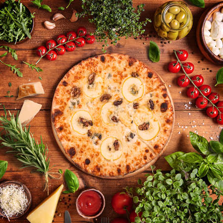 Italian PIZZA top view with vegetables backgroundの写真素材
