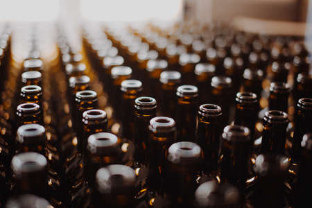 Industrial view bottle wine. Close up winery factory.の写真素材