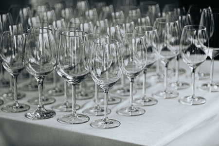 Wine glasses on the table. Black and white. Selective focus.の写真素材