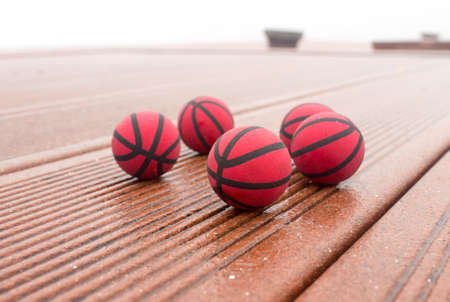 Wet basketballs on the streetの写真素材